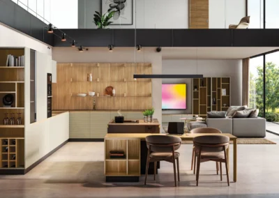 Cocina abierta al salón con frentes de madera natural, isla con mesa comedor, vinoteca integrada y doble altura