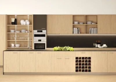 Cocina lineal de madera nogal con encimera oscura, vinoteca doble, estanterías abiertas y mesa de comedor integrada